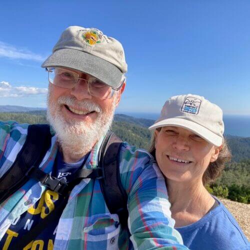 two hikers smiling