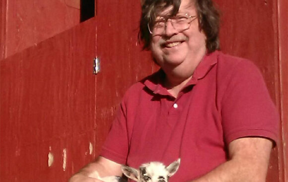 Peter Ruddock with Fonzie the baby goat