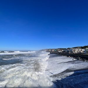 surf crashing against sea wall in Pacifica