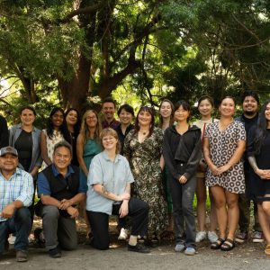 Leadership Program graduates, class of 2025, standing together under trees